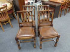 A set of four 20th century oak dining chairs