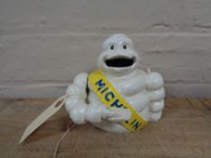 A metal novelty money box - Michelin man