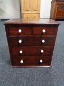 An early 19th century mahogany five drawer apprentice chest