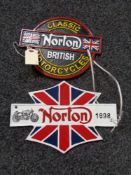 Two metal Norton plaques