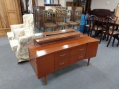 A mid 20th century teak dressing table