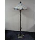 An Art Deco style floor lamp with leaded glass shade