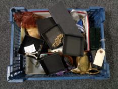 A basket of costume jewellery, beaded purses,