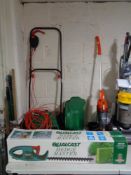 A boxed Qualcast hedge trimmer and Qualcast lawn mower