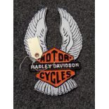 A metal Harley Davidson plaque