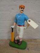 A metal door stop - Cricketer