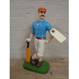 A metal door stop - Cricketer