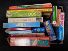 A box of twentieth century jigsaws and games,