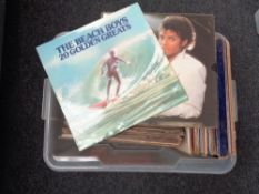 A box of vinyl lps including Stevie Wonder, Bee Gees,