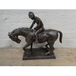 A metal figure - Horse with jockey