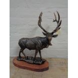 A metal figure - Stag on wooden base