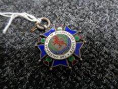 A silver and enamel medal for the Caledonian society of Johannesburg