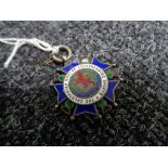 A silver and enamel medal for the Caledonian society of Johannesburg