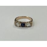 A three stone diamond and sapphire ring, approx.