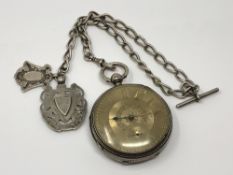 A heavy large silver pocket watch with silver dial on silver Albert chain CONDITION