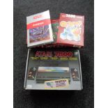 A boxed Atari 7800 together with eighteen boxed games