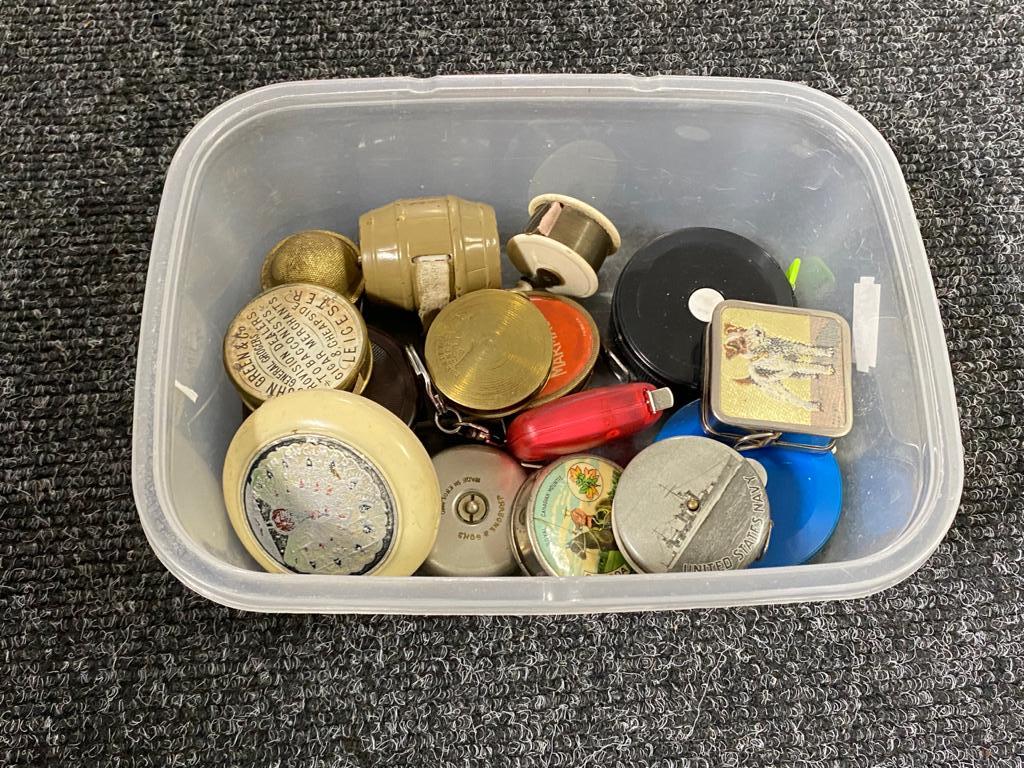 A box of a collection of sewing tape measures