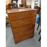 A mid 20th century five drawer oak chest