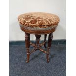 A Victorian inlaid mahogany revolving stool