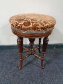 A Victorian inlaid mahogany revolving stool