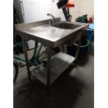 A stainless steel Vogue commercial single sink and drainer