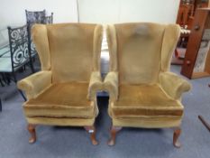 A pair of dralon mustard coloured armchairs