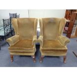 A pair of dralon mustard coloured armchairs