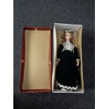 A boxed porcelain collection doll