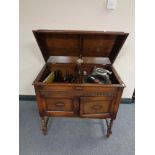 An early 20th century Gilbert gramophone with cabinet and spare turn table