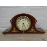 An early twentieth century inlaid mahogany Swiss made eight day mantel clock on brass feet