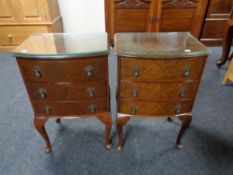 A pair of mahogany three drawer bedside chests