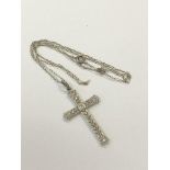 An 18ct white gold diamond set cross on chain CONDITION REPORT: Cross dimensions