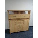 A contemporary oak effect sideboard and entertainment stand