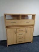 A contemporary oak effect sideboard and entertainment stand