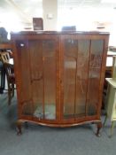 A 1930's walnut display cabinet