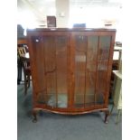 A 1930's walnut display cabinet