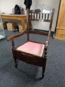 An Edwardian commode armchair