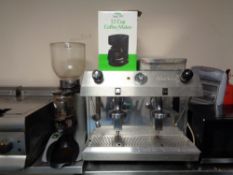 A Fracino stainless steel commercial two cup coffee maker with accessories and an Expobar coffee