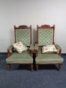 A pair of Edwardian gentleman's armchairs in green dralon