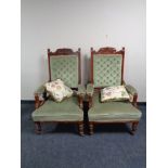 A pair of Edwardian gentleman's armchairs in green dralon