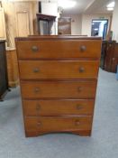 A mid 20th century five drawer chest