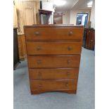 A mid 20th century five drawer chest