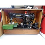 A cased mid century Singer sewing machine