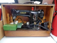 A cased mid century Singer sewing machine