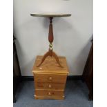 A pine three drawer bedside chest and a wine table