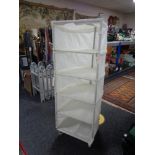 Two portable fabric shelving units