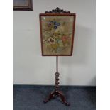A Victorian mahogany barley twist pole screen with tapestry panel