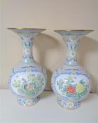 A pair of 20th century floral patterned enamel vases,