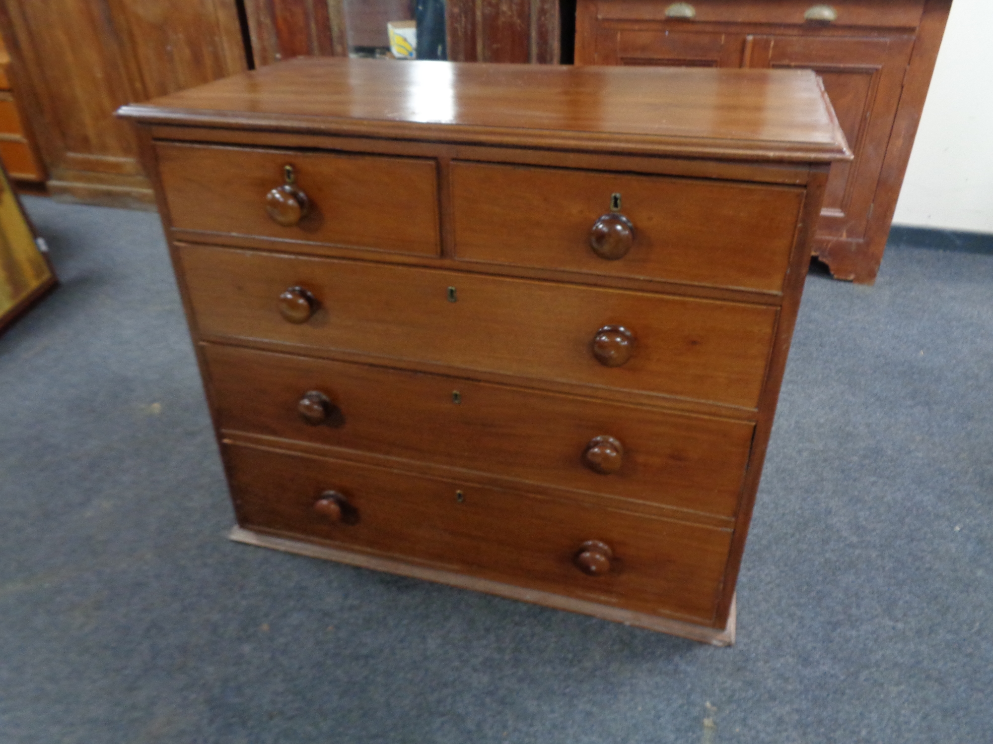 A Victorian mahogany five drawer chest