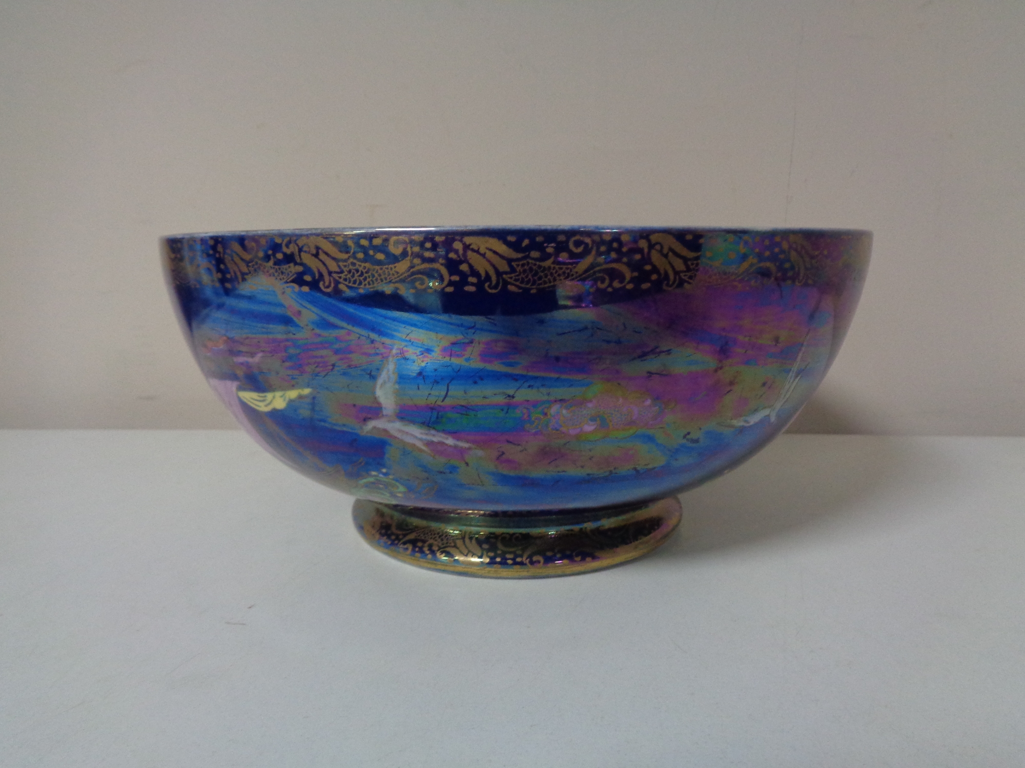 A large Maling lustre bowl modelled with tall ships and birds,